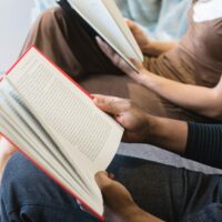 man-reading-book-beside-woman-reading-book-545068